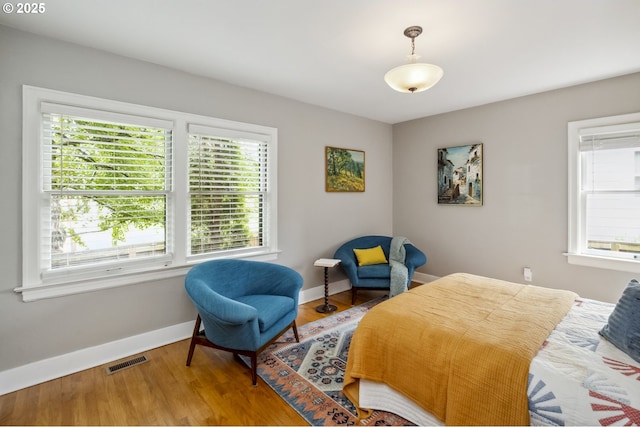 3622 NE Hassalo St, Portland, OR 97232 - bedroom with multiple windows and wood finished floors