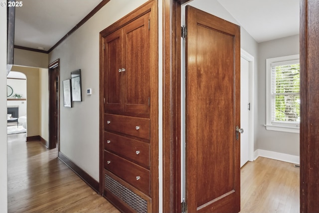 3622 NE Hassalo St, Portland, OR 97232 - corridor featuring light wood finished floors, ornamental molding, and arched walkways