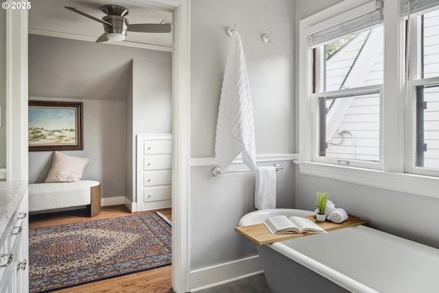 3622 NE Hassalo St, Portland, OR 97232 - full bath with a soaking tub, wood finished floors, ceiling fan, and vanity