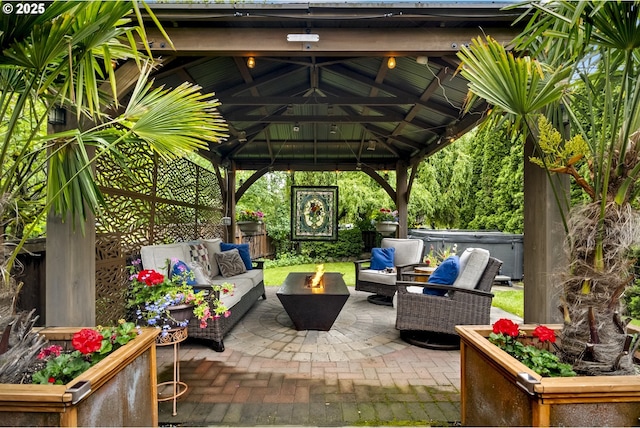 3622 NE Hassalo St, Portland, OR 97232 - view of patio with a hot tub, a gazebo, and an outdoor living space with a fire pit
