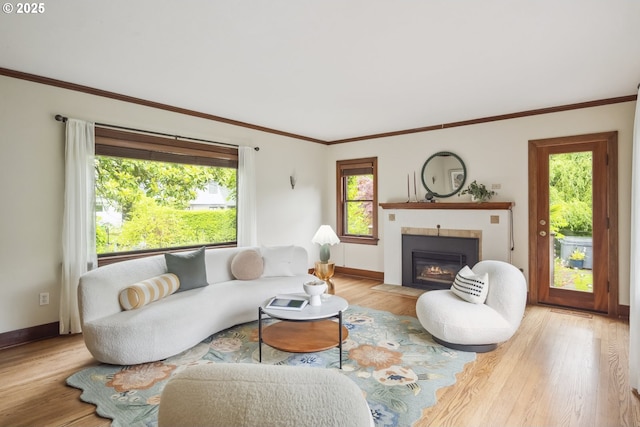 3622 NE Hassalo St, Portland, OR 97232 - living area with light wood-style flooring, a fireplace with flush hearth, healthy amount of natural light, and ornamental molding