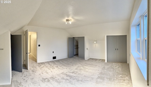 632 SW Utah St, Camas, WA 98607 - unfurnished bedroom featuring lofted ceiling, multiple closets, light carpet, and a textured ceiling
