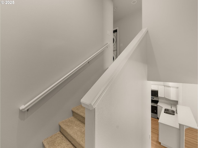 stairway featuring wood finished floors