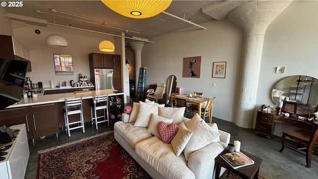1314 NW Irving St Unit 613, Portland, OR 97209 - living area with decorative columns and concrete floors