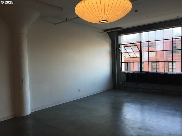 1314 NW Irving St Unit 613, Portland, OR 97209 - unfurnished room with finished concrete floors and baseboards