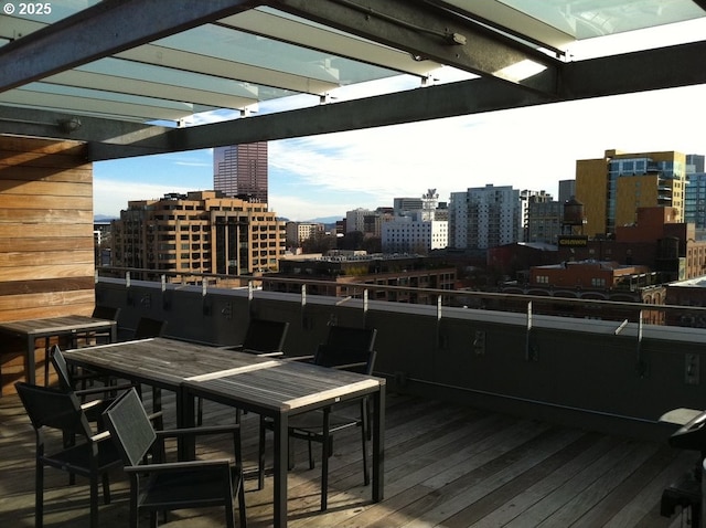 1314 NW Irving St Unit 613, Portland, OR 97209 - wooden deck with a city view and outdoor dining area