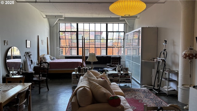 1314 NW Irving St Unit 613, Portland, OR 97209 - bedroom with finished concrete floors and multiple windows