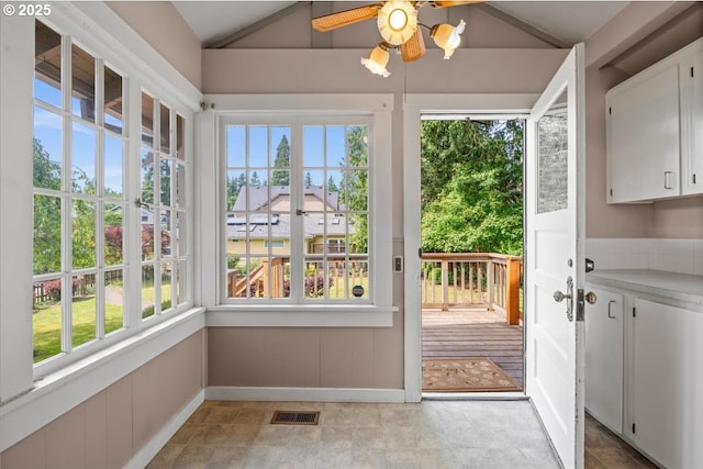 4623 SW Garden Home Rd, Portland, OR 97219 - unfurnished sunroom featuring lofted ceiling and baseboards
