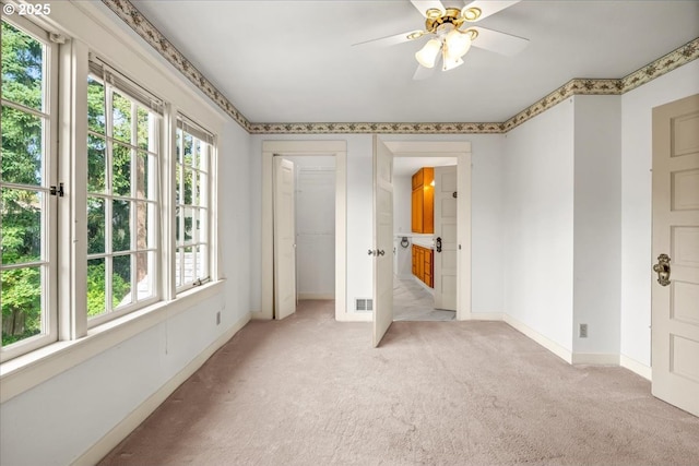 4623 SW Garden Home Rd, Portland, OR 97219 - unfurnished bedroom featuring light colored carpet, baseboards, and ceiling fan