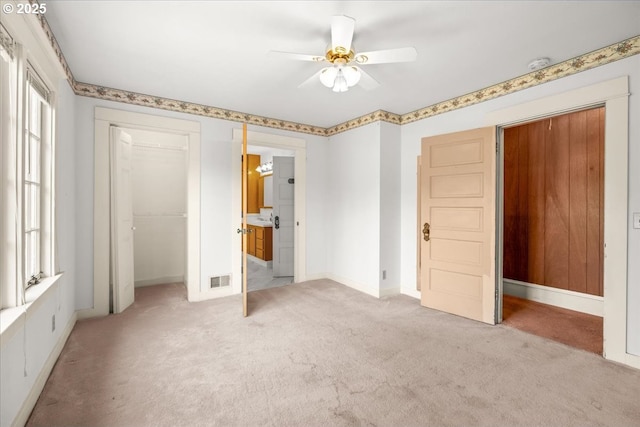 4623 SW Garden Home Rd, Portland, OR 97219 - unfurnished bedroom featuring light colored carpet, a closet, baseboards, and ceiling fan