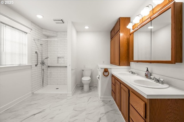 4623 SW Garden Home Rd, Portland, OR 97219 - bathroom with marble finish floors, baseboards, double vanity, tiled shower, and recessed lighting