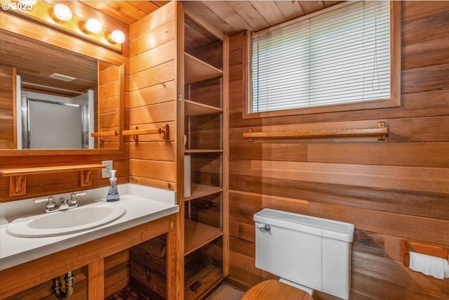 4623 SW Garden Home Rd, Portland, OR 97219 - bathroom featuring wood walls, wooden ceiling, vanity, and toilet