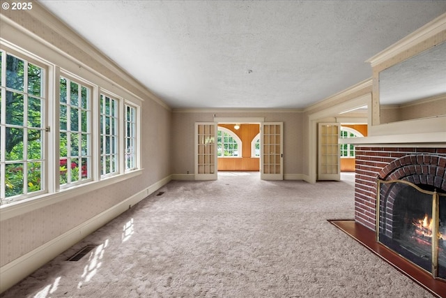 4623 SW Garden Home Rd, Portland, OR 97219 - unfurnished living room with a brick fireplace, ornamental molding, a textured ceiling, carpet floors, and baseboards