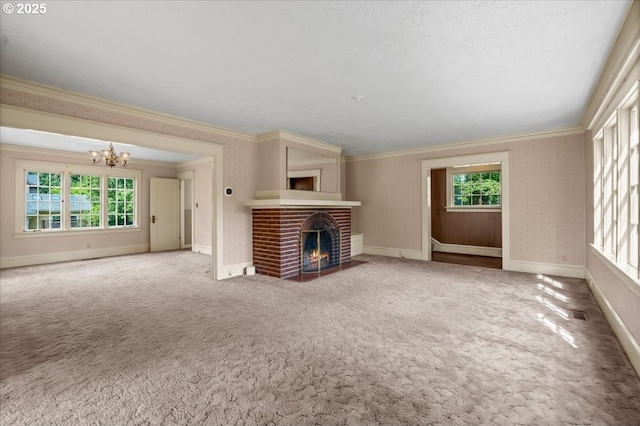 4623 SW Garden Home Rd, Portland, OR 97219 - unfurnished living room with a chandelier, crown molding, a fireplace, carpet floors, and baseboards