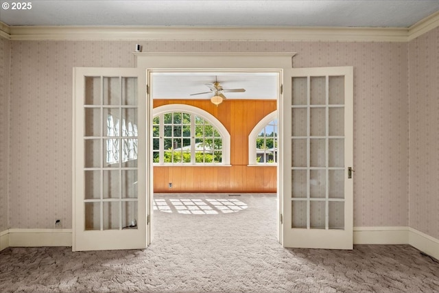 4623 SW Garden Home Rd, Portland, OR 97219 - carpeted spare room featuring wallpapered walls, french doors, and a ceiling fan