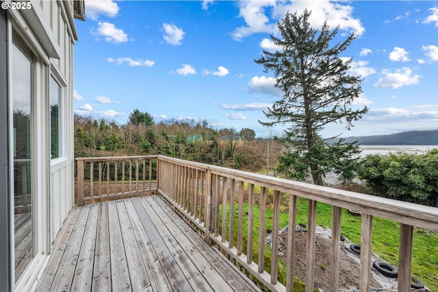 deck featuring a water view