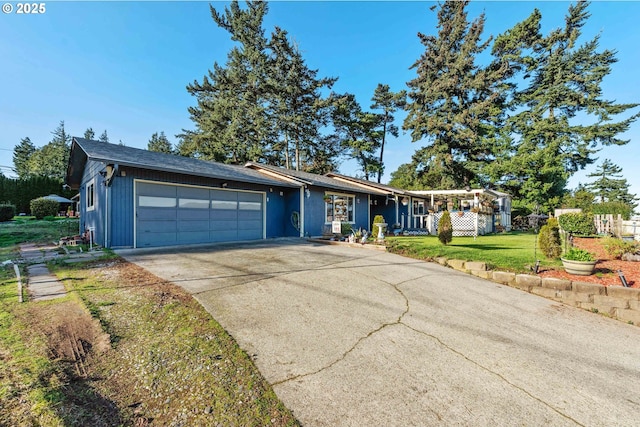 single story home featuring a garage and a front yard