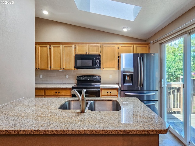 1684 NE 87th Ave, Hillsboro, OR 97006 - kitchen with black appliances, vaulted ceiling, a sink, decorative backsplash, and a skylight