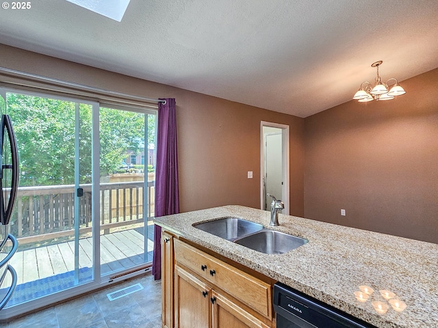 1684 NE 87th Ave, Hillsboro, OR 97006 - kitchen with a sink, black dishwasher, light stone countertops, and hanging light fixtures
