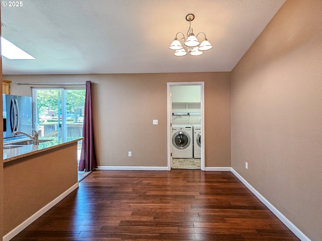 1684 NE 87th Ave, Hillsboro, OR 97006 - unfurnished dining area featuring separate washer and dryer, a sink, a chandelier, and dark wood-style flooring
