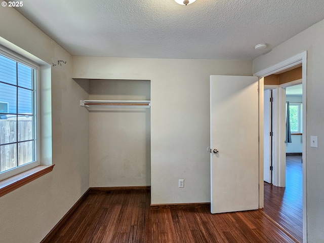 1684 NE 87th Ave, Hillsboro, OR 97006 - unfurnished bedroom with dark wood finished floors, a closet, a textured ceiling, and baseboards