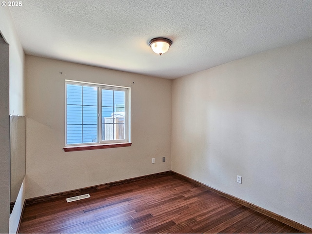 1684 NE 87th Ave, Hillsboro, OR 97006 - spare room featuring dark wood finished floors, baseboards, and a textured ceiling
