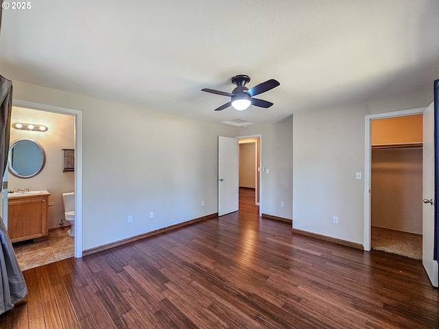 1684 NE 87th Ave, Hillsboro, OR 97006 - unfurnished bedroom with wood finished floors, a walk in closet, and baseboards
