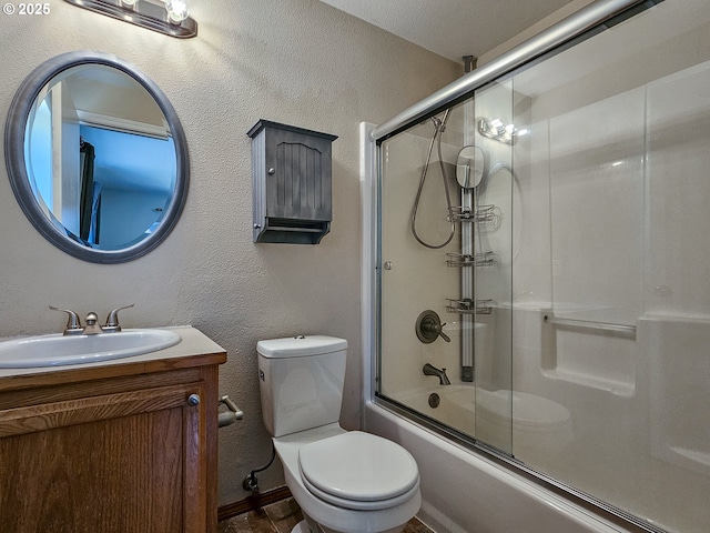 1684 NE 87th Ave, Hillsboro, OR 97006 - bathroom with vanity, combined bath / shower with glass door, toilet, a textured wall, and baseboards