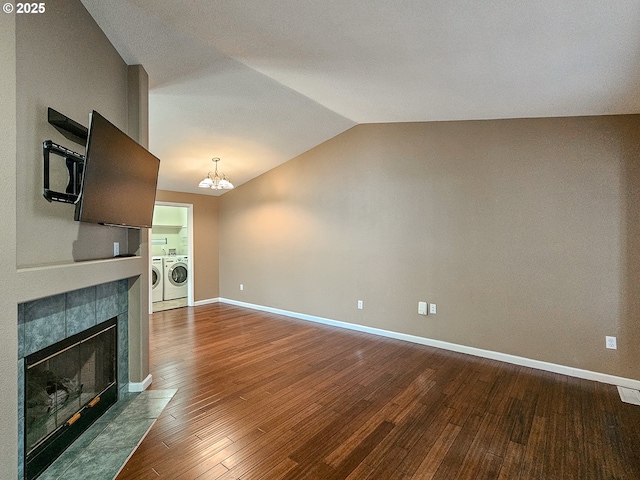 1684 NE 87th Ave, Hillsboro, OR 97006 - unfurnished living room featuring washing machine and dryer, a chandelier, dark wood finished floors, vaulted ceiling, and baseboards