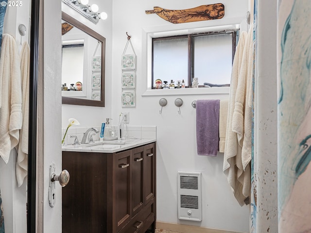 1560 S Downing St, Seaside, OR 97138 - bathroom featuring vanity and heating unit