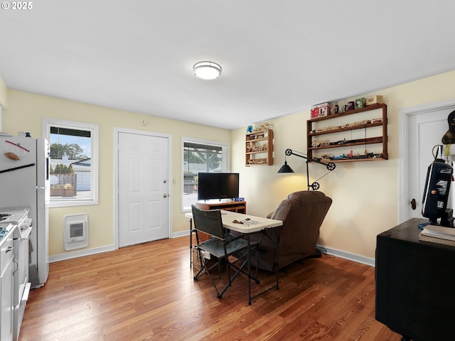 1560 S Downing St, Seaside, OR 97138 - office area with light wood-type flooring, baseboards, and heating unit