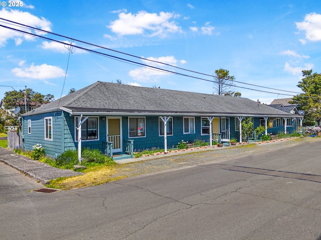 1560 S Downing St, Seaside, OR 97138 - view of front facade featuring covered porch and roof with shingles