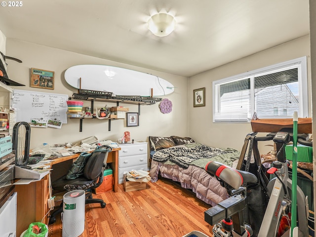 1560 S Downing St, Seaside, OR 97138 - bedroom featuring wood finished floors and a desk
