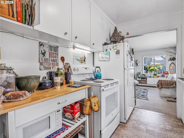 1560 S Downing St, Seaside, OR 97138 - kitchen featuring white appliances, white cabinetry, and wooden counters