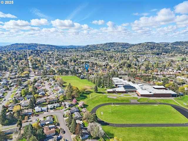 aerial perspective of suburban area featuring a mountain backdrop