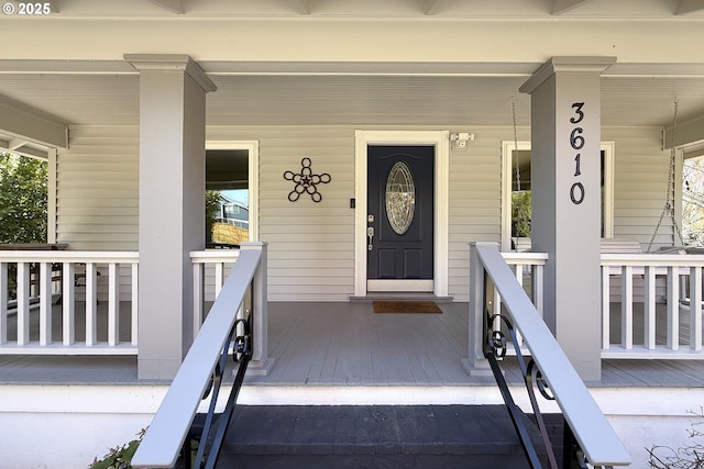 doorway to property with covered porch