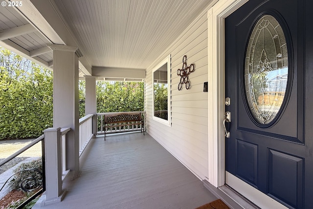 property entrance featuring covered porch