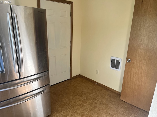 61476 Dee Cox Rd, Heppner, OR 97836 - kitchen with freestanding refrigerator, tile patterned floors, and baseboards