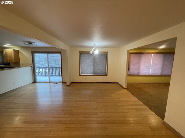 unfurnished living room featuring light hardwood / wood-style flooring