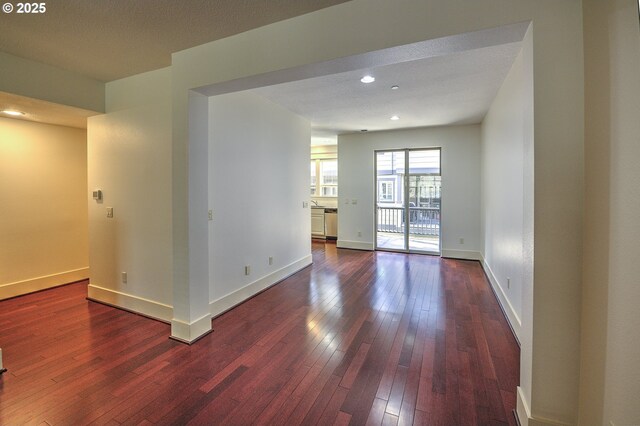619 SW Foresta Ter, Portland, OR 97225 - unfurnished room featuring dark wood-style floors, baseboards, and recessed lighting