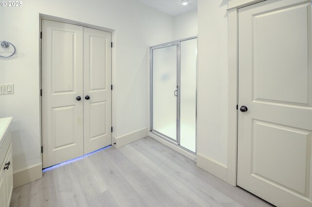 619 SW Foresta Ter, Portland, OR 97225 - unfurnished bedroom featuring light wood finished floors and baseboards