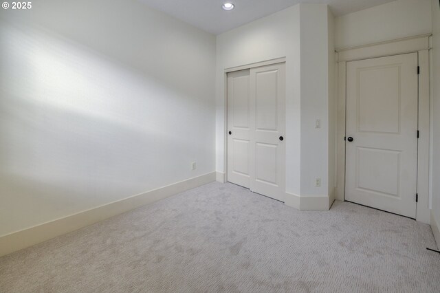 619 SW Foresta Ter, Portland, OR 97225 - unfurnished bedroom with carpet, recessed lighting, a closet, and baseboards