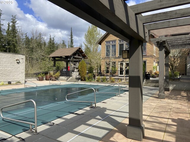 619 SW Foresta Ter, Portland, OR 97225 - view of swimming pool featuring a pergola and a patio area