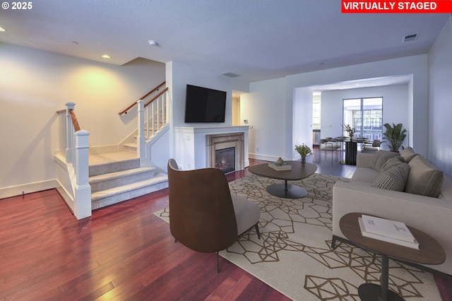 619 SW Foresta Ter, Portland, OR 97225 - living area with wood finished floors, a glass covered fireplace, stairway, recessed lighting, and baseboards