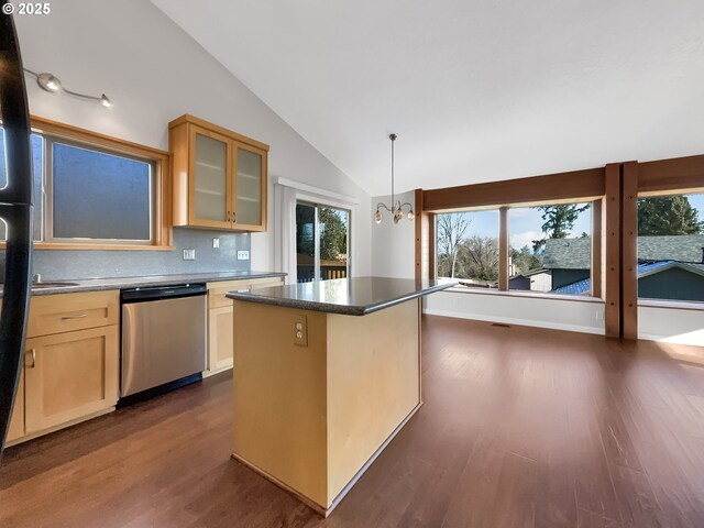 kitchen featuring dark wood finished floors, dishwasher, lofted ceiling, glass insert cabinets, and a center island