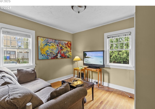 4105 NE 77th Ave, Portland, OR 97218 - living room with baseboards, crown molding, and wood finished floors