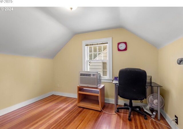 4105 NE 77th Ave, Portland, OR 97218 - office featuring wood finished floors, vaulted ceiling, cooling unit, and baseboards