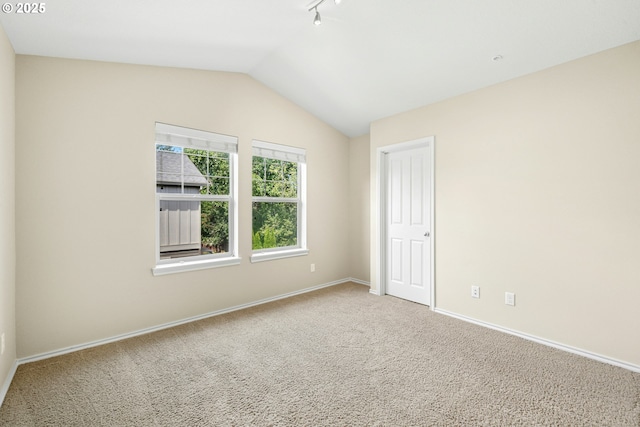 15971 NW Hildago Ln, Portland, OR 97229 - carpeted empty room with baseboards and lofted ceiling