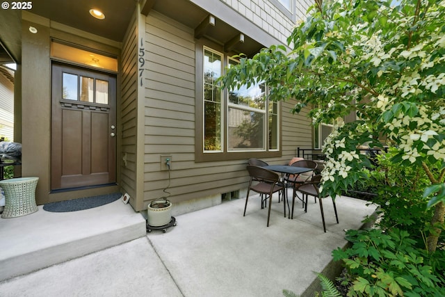 15971 NW Hildago Ln, Portland, OR 97229 - property entrance with outdoor dining area and a patio