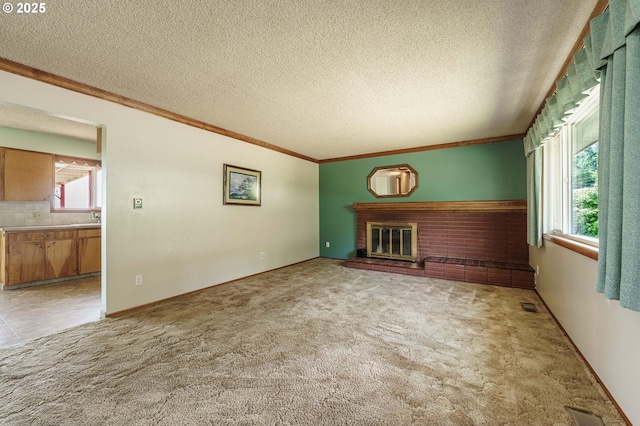 1938 NW Sierra Ln, Camas, WA 98607 - unfurnished living room featuring a brick fireplace, healthy amount of natural light, light colored carpet, crown molding, and a textured ceiling